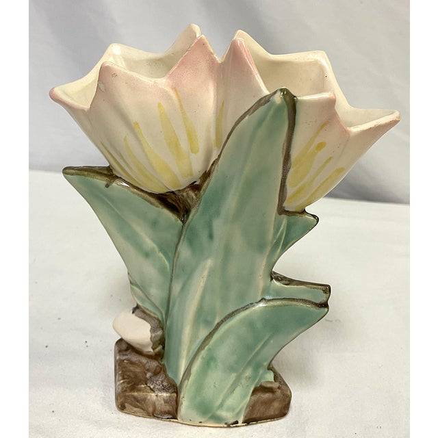 Highly collectible McCoy pottery vase from the 1940's. This piece is from the floral collection and depicts two open...
