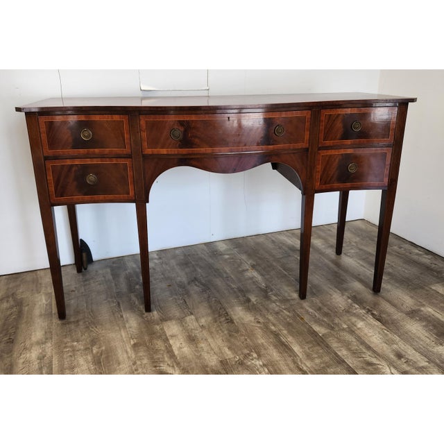 This Tibbenham of Ipswich Georgian Hepplewhite-style 5 drawer sideboard is a high-quality piece of British furniture,...
