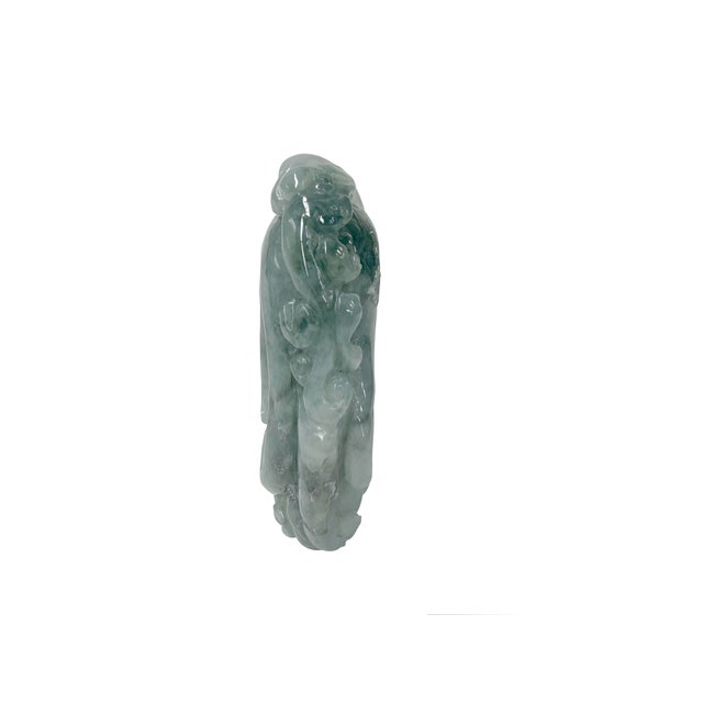 This exquisite natural jadeite carving features a dynamic, high-relief design blending mottled sage green and pale icy...