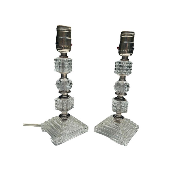 The art deco crystal cut chrome set of lamps features a polished chrome base with intricate crystal-cut details, giving it...