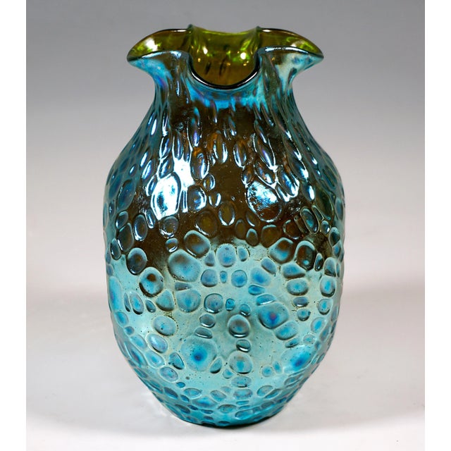 In the model with irregular spherical decor blown body in baluster shape, round stand, bulbous widening upwards with four...