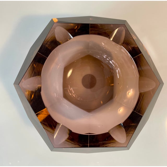Faceted ashtray made of amethyst-colored Murano glass in perfect condition This piece is attributed to the mentioned...