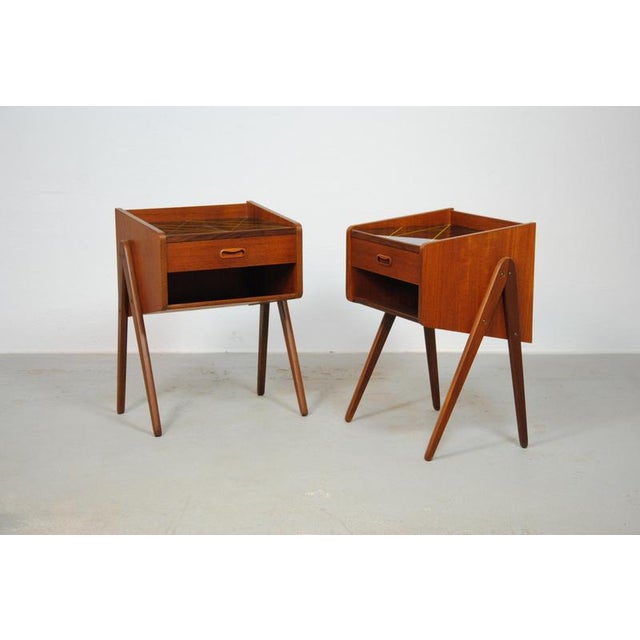 1960s teak nightstands with decorated glass tabletops The set feature two fully restored teak nightstands with decorated...