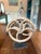 Add authentic industrial history to your collection with this striking set of three antique wood and cast iron pulleys,...