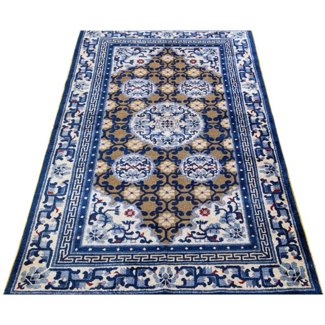 Transform the look of your home with this incredible antique Chinese Peking wool rug. This unique handmade piece is...