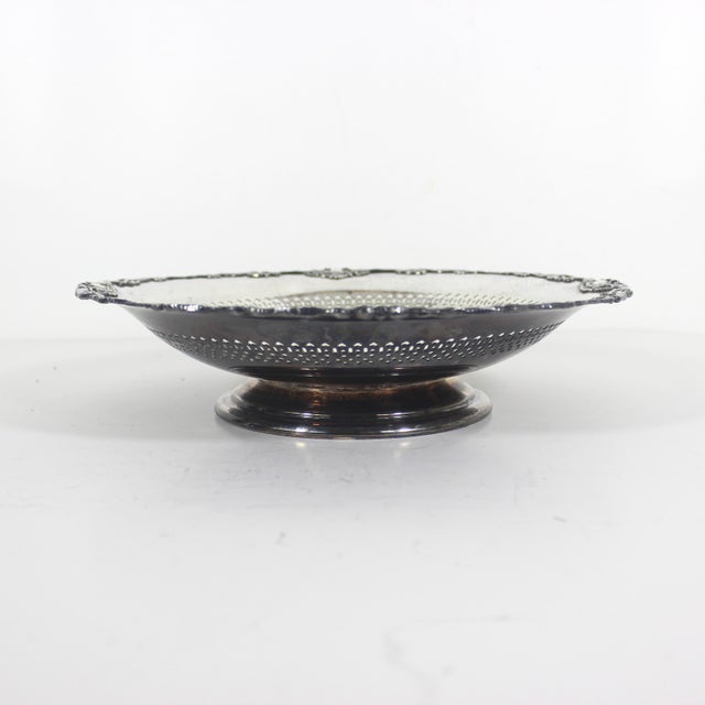 Beautiful silver plated bowl with a raised art nouveau style ribbon and flower detail around the rim and a pierced edge. I...