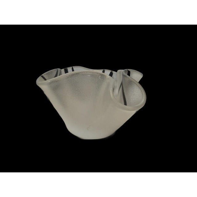 This is a frosted glass bowl produced by the renowned Swedish glassworks company Kosta Boda. The designer is Ulrica...