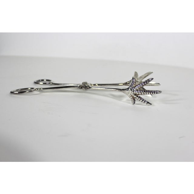 Vintage silver plated serving tongs with bird claw tips. Perfect for bar cart styling. Could be used to serve anything...