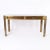 Impressive vintage writing desk crafted in bronze with a hip acid washed finish, in a stylized classic form having a black...