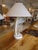 Stylish palm frond inspired lamps, painted metal with ivory/beige travertine bases and matching round finials. Bases are...