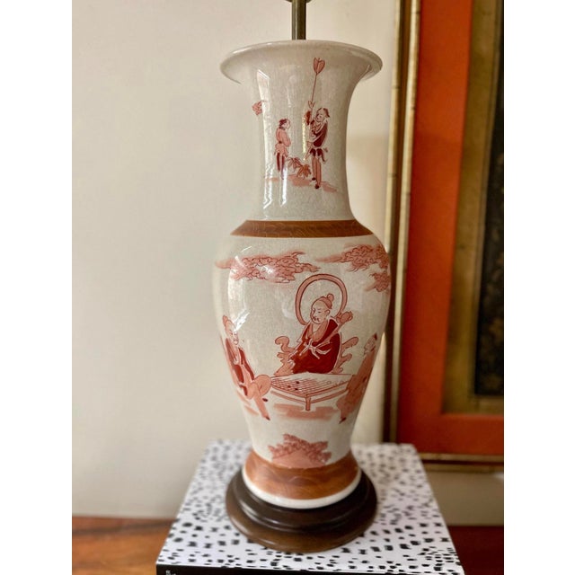 Gorgeous Asian lamp, taller size measuring 25 inches to the top of the socket, it is presented in a deep ox blood and...
