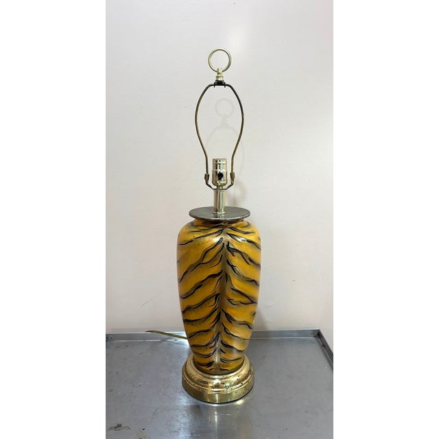 1970s-80s ceramic painted tiger-print lamp w/ brass base. Some mild patina to metal at base as shown. Otherwise excellent...