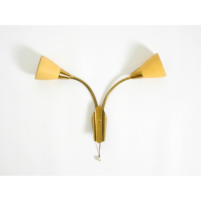 Beautiful mid-century modern brass wall lamp with double gooseneck arms and shades. manufacturer: cosack leuchten. Made in...