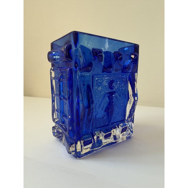 A pressed glass vase designed by Josef Schott for Smålandshyttan, Sweden, in the 1960s. Each of the four faces carries a...