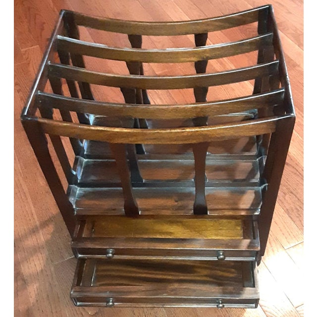 Classic solid mahogany magazine and book stand with two drawers. Made in the late 1900's. Has several sections for...