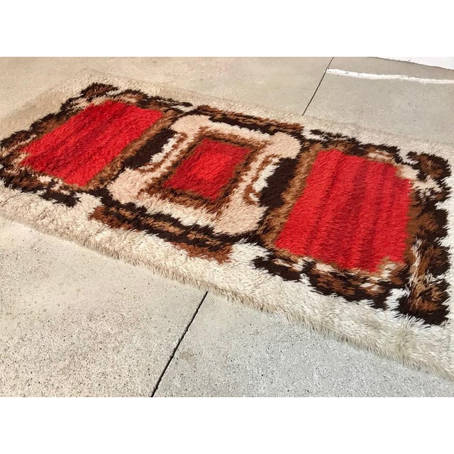 This woolen wall or floor rug was manufactured in Scandinavia during the 1960s. The quality piece features a nice...