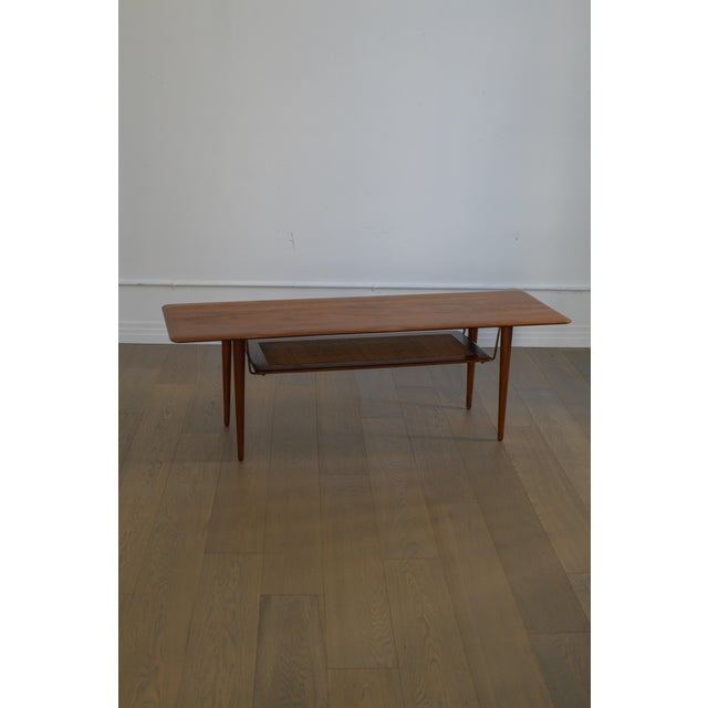 1950s Peter Hvidt & Orla Mølgaard Nielsen FD 516 coffee table by France & Sons, Denmark. This gorgeous teak coffee table...