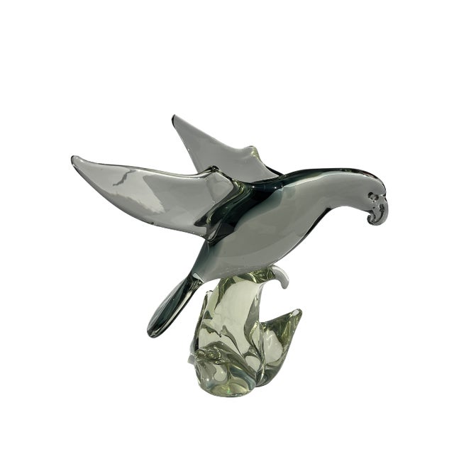 A striking vintage modernist blown art glass bird sculpture featuring an elegant elongated form and sculptural wings in...