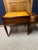 Elegant mid-century mahogany nightstand in the Georgian Revival style. Two drawers with original brass bail handles,...