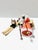 A charming Christian Ulbricht German Santa smoker figure featuring Santa Claus skiing with a basket of toys, lantern, and...