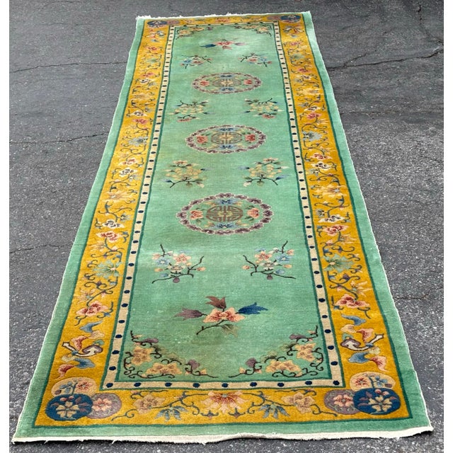 An attractive Chinese runner, it’s absolutely stunning color combination. It measures 3’ X 11’7” It’s in a low pile.