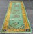 An attractive Chinese runner, it’s absolutely stunning color combination. It measures 3’ X 11’7” It’s in a low pile.