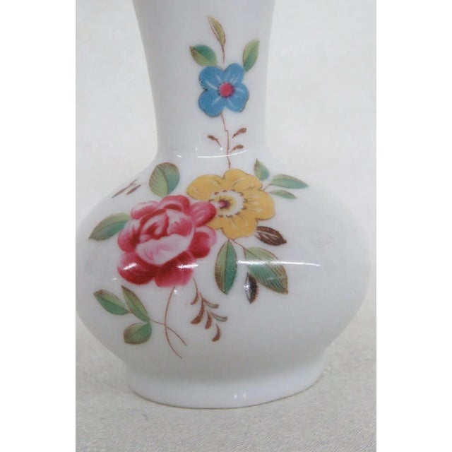 This charming miniature vase is made out of porcelain. This piece is stamped "Decorative China", see pictures, and it...