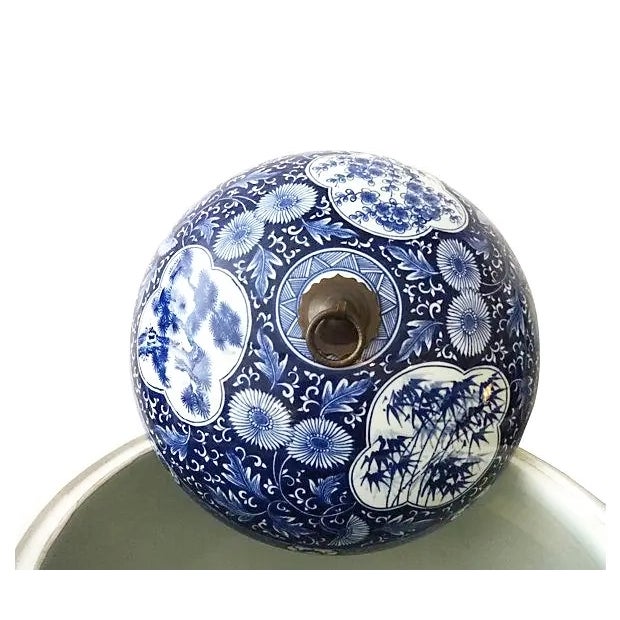 A magnificent set of substantial blue-and-white porcelain ginger jars featuring intricate dragon motifs complemented by...