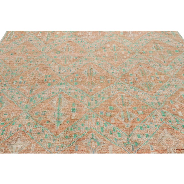 Hand-knotted in wool and silk, this 8x10 contemporary rug from Rug & Kilim features geometric patterns with a modern...