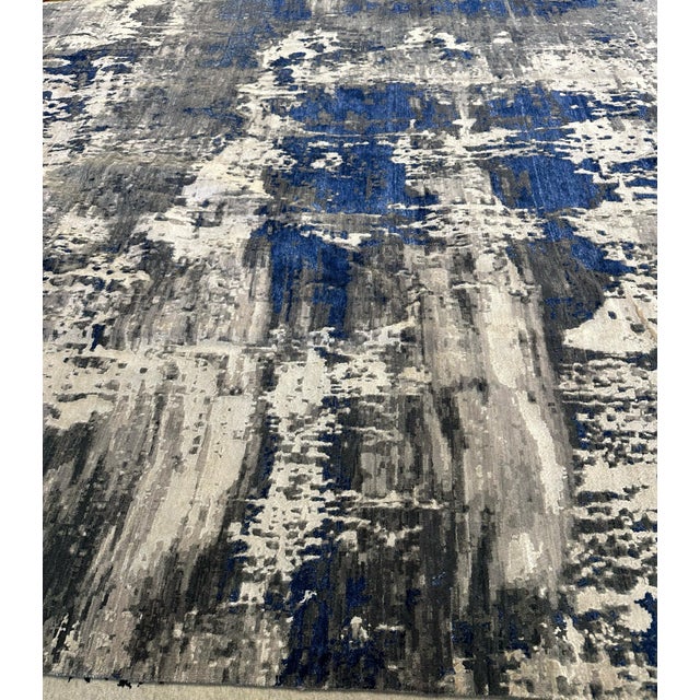 A Contemporary Abstract Rug with an Artistic Presence This hand-knotted rug from Nepal is a striking example of where fine...