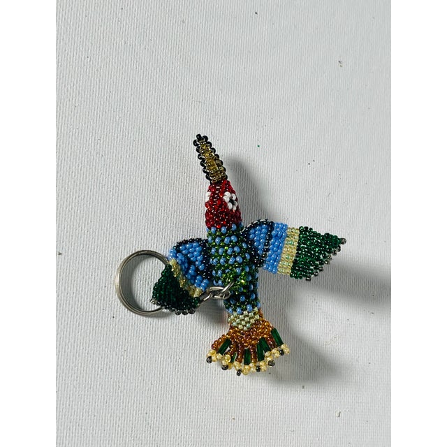 Handmade vintage beaded tropical bird of Paradise figurine as key chain locket.