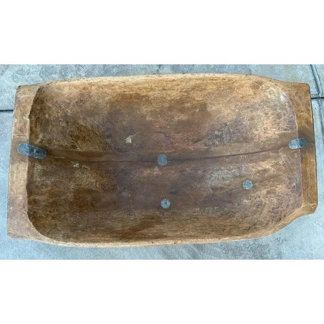 This fine country /rustic hand carved large dough bowl is in great condition. It has old metal repairs inside of the bowl...