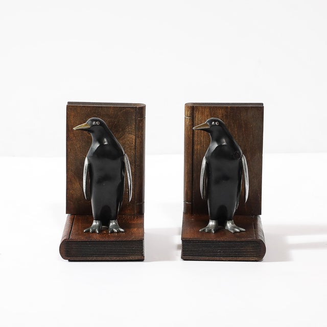 This charming pair of Art Deco sculptural bookends features a playful and elegant penguin design, showcasing the...
