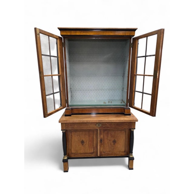 Antique Biedermeier Style Walnut Bookcase Vitrine with Glass Doors &amp; Ebonized Columns An elegant early 20th century...