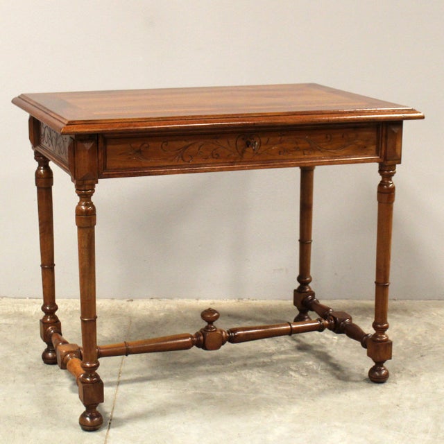 Coffee table - writing desk Solid walnut, with drawer Late 19th century Dimensions: 91 cm x 58 cm, height 74 cm Restored...
