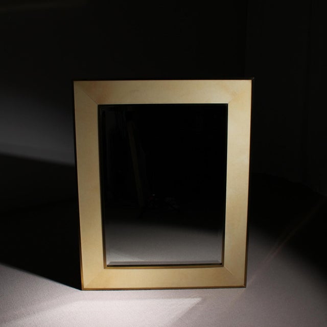 ​For sale is a large-format wall mirror by the Italian designer Aldo Tura from the 1970s. The frame features hand-applied...