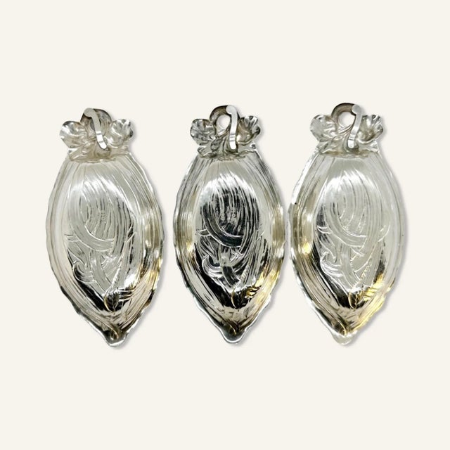 3 Gorham sterling silver nut dishes marked Gorham Sterling 104B. Almond shaped, the dishes have a leaves and blossoms...