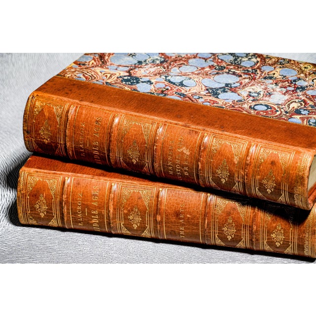 Step into a world of medieval splendor and Renaissance refinement with this remarkable two-volume antique illustrated book...