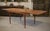 A Danish teak dining table, typical of 1960s Scandinavian design, with clean, balanced lines. The rectangular top features...