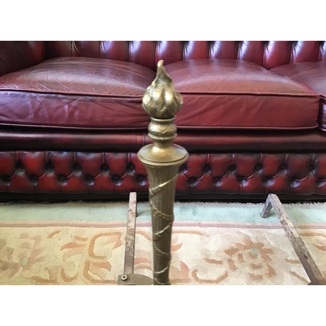 A pair of Solid Brass Andirons. These are 21" tall, 16” deep. Brass has darkened with age, we have not attempted any...