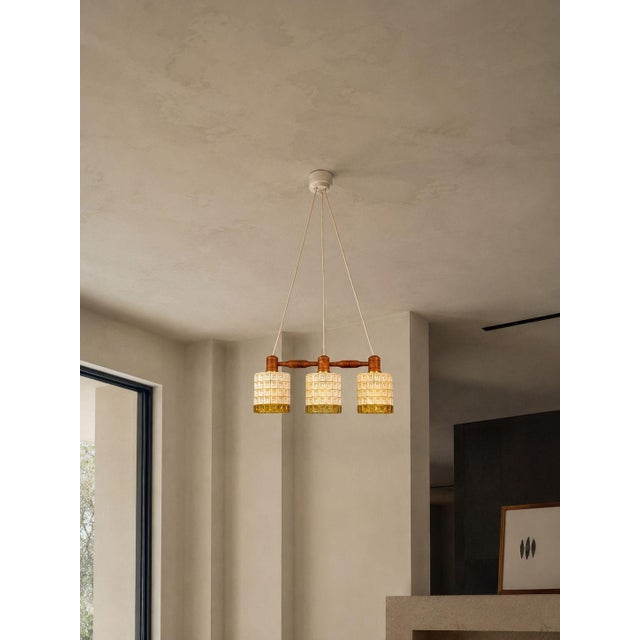 Swedish Mid-Century Modern, Three Light Pendant Light, Teak, Glass, Brass, Sweden, 1950s A unique triple light pendant...