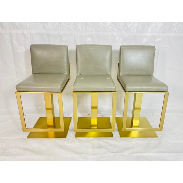 A sculptural set of three “Lobby” counter stools designed by Lisa Taylor and designed and manufactured in Canada,...