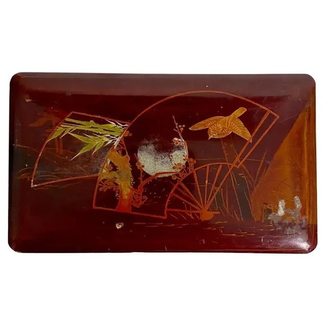 Beautiful Japanese red lacquered wood box; 19th century The lid was decorated with a landscape with a bird, trees and a...
