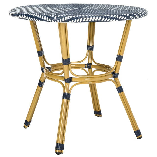 Embrace your inner Parisian with this traditional rattan bistro side table. Crafted to honor the classic French design,...