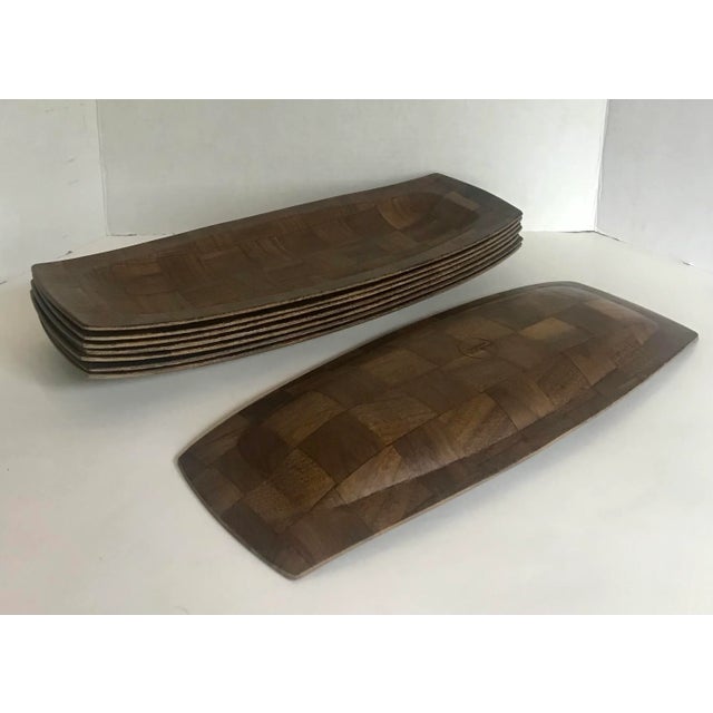 Here is a great set of 8 long and shallow bowls that are made by weaving wood together into a checker-like pattern. They...