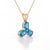 A dazzling three-stone design featuring oval-cut natural blue topaz arranged in a graceful trefoil formation, secured in a...