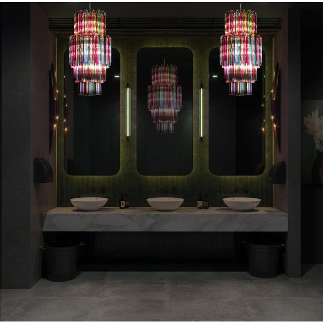 Amazing pair murano chandeliers. Each made by 242 murano crystal multicolored prism (triedri) on four levels in a nickel...