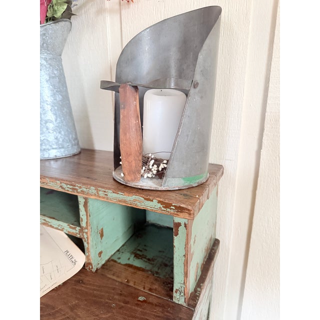 A sturdy relic of early industrial design, this antique desk wears its history proudly. The original green paint, softened...