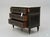 An elegant French Louis XVI style three-drawer commode (chest of drawers) featuring a striking ebonized black. The chest...