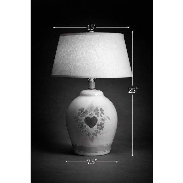 Charming and quietly nostalgic, this hand-painted ceramic urn lamp brings soft color, warmth, and storybook character into...